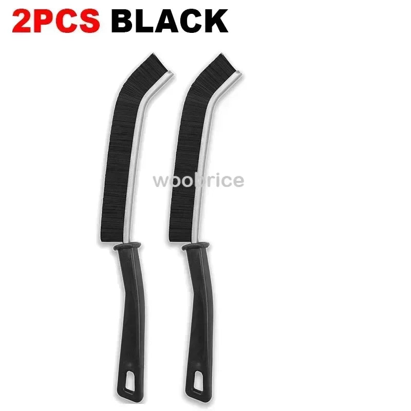 Two black multifunctional hard bristle crevice cleaning brushes.