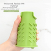 A hand holds a bright green silicone sink splash guard drip catcher mat.
