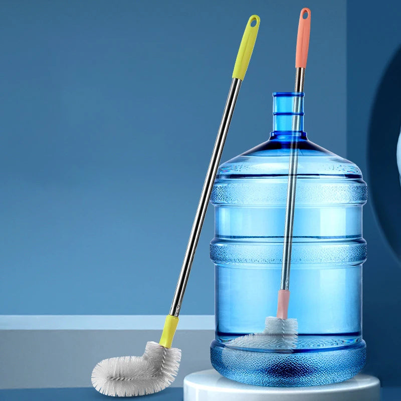 A blue plastic water dispenser is shown with a cleaning brush featuring a stainless steel handle and a yellow or orange brist