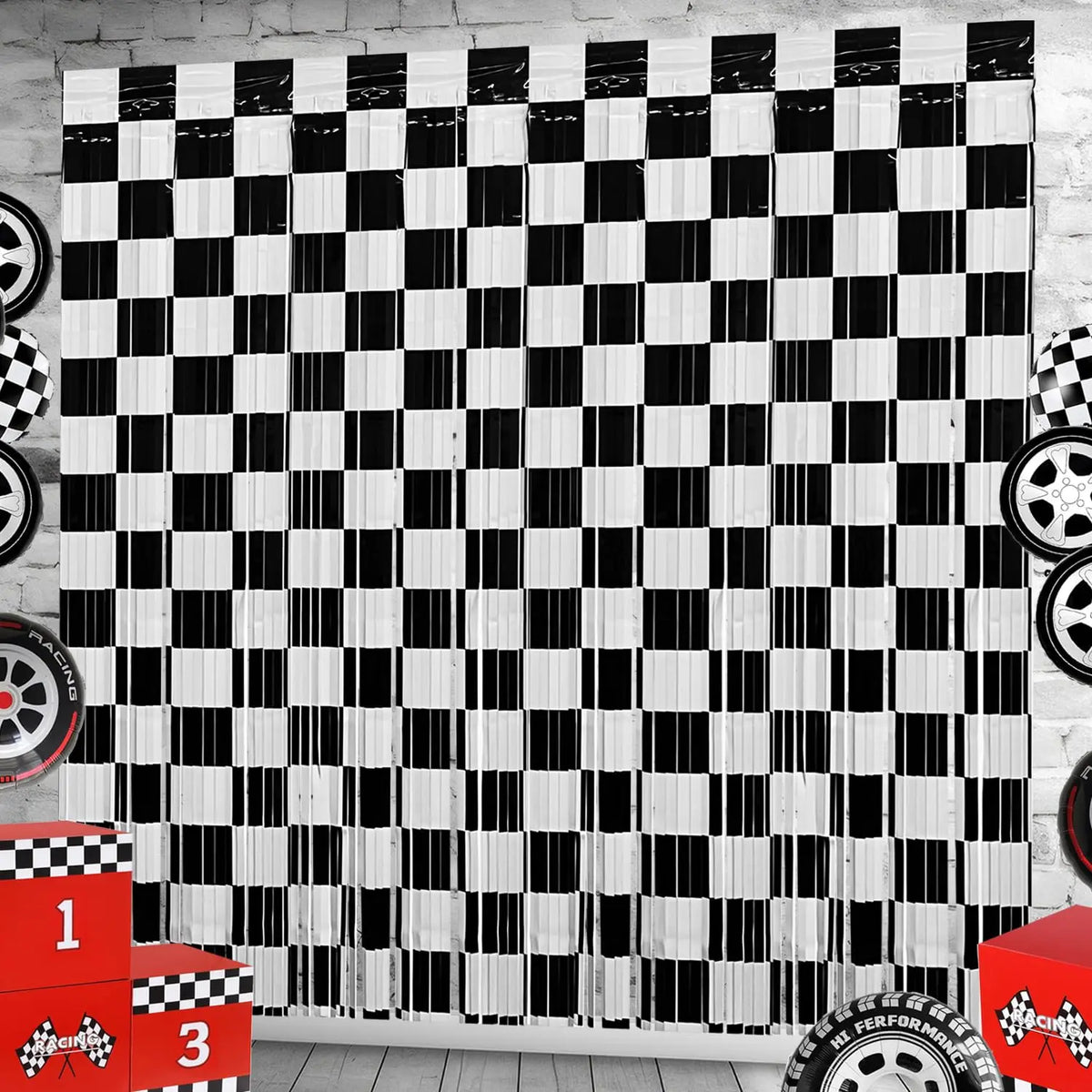 A seamless black and white checkered foil curtain backdrop with a distressed wood texture.