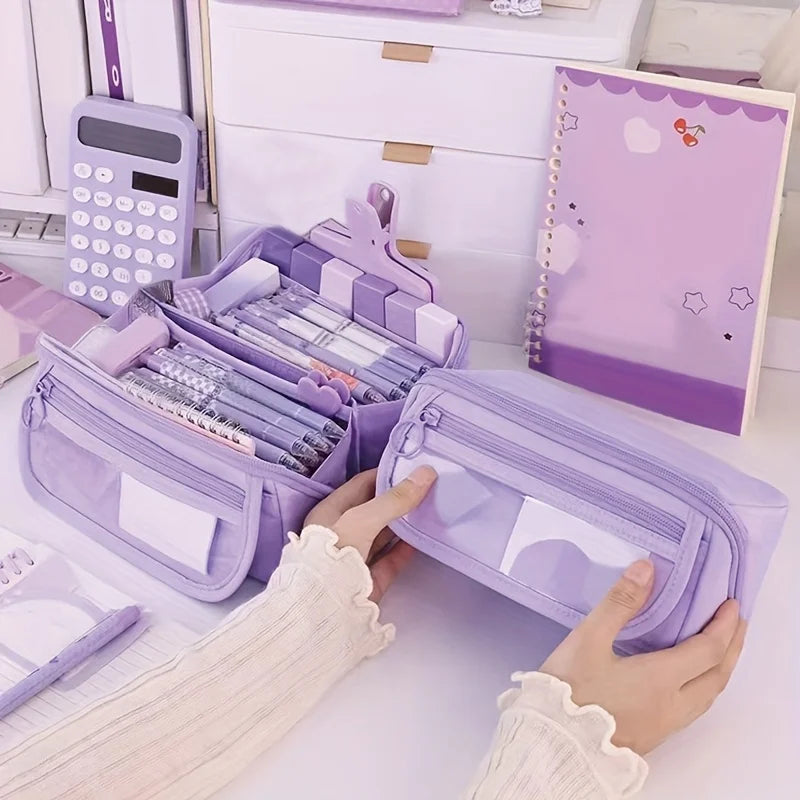 A purple multi-compartment pencil case organizer is being held by hands on a white desk surface.