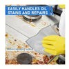 Yellow glove holding a gray metal wire cleaning cloth used for easily handling oil stains and repairs on surfaces.