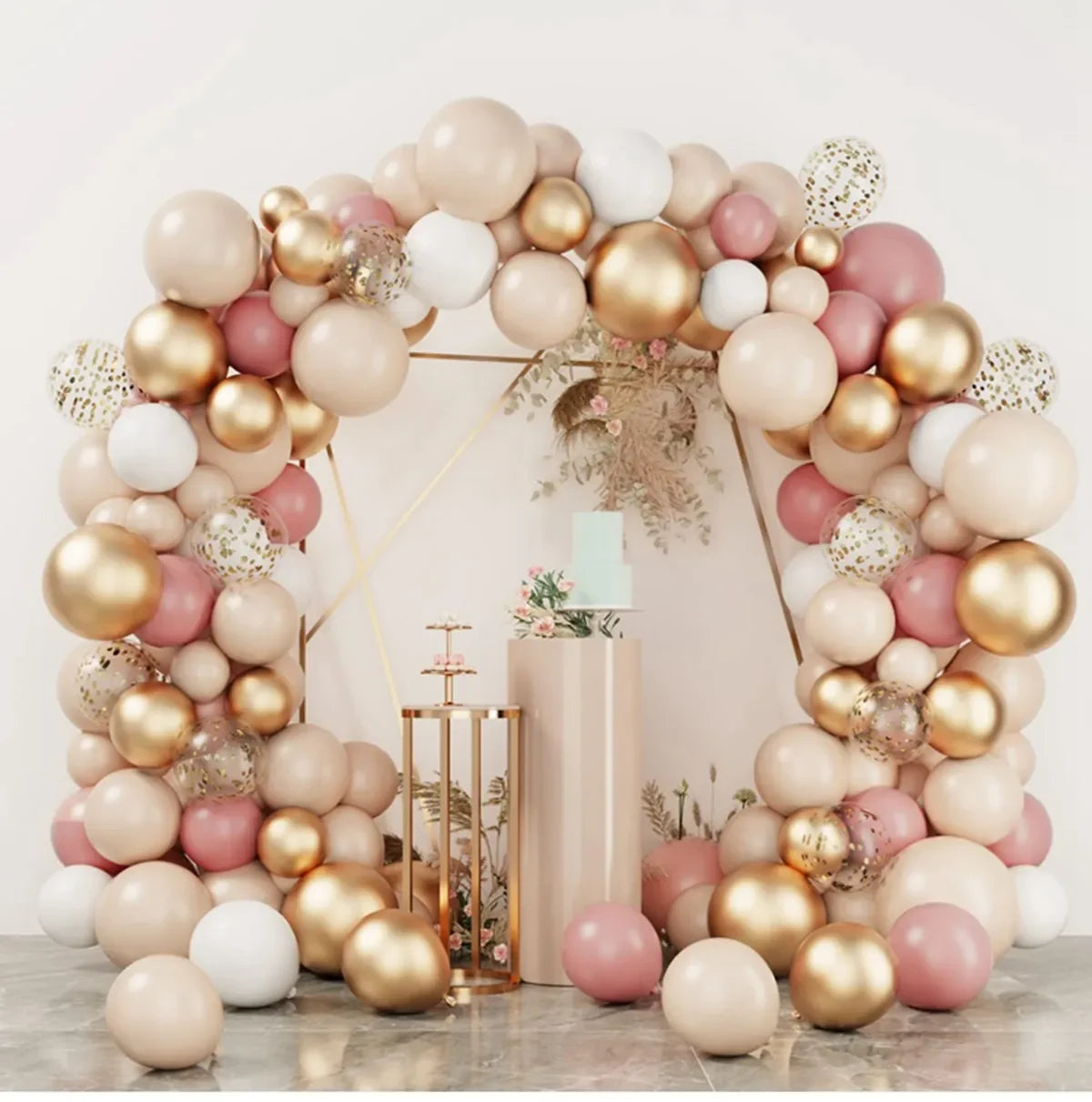 A round foil balloon garland kit featuring pink, beige, and gold balloons arranged in an archway.