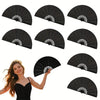 A woman holds a black handheld folding fan with a classic design.