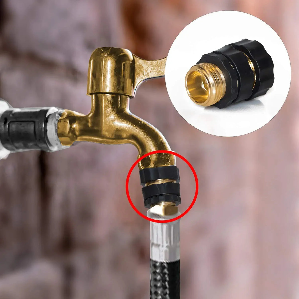 Close-up of a brass garden hose coupler with a black quick release fitting attached to a silver hose.