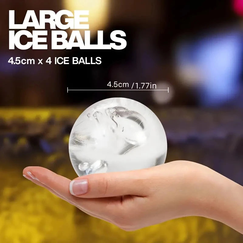 A hand holds a large clear ice ball, demonstrating the size of the 4.5cm ice balls.