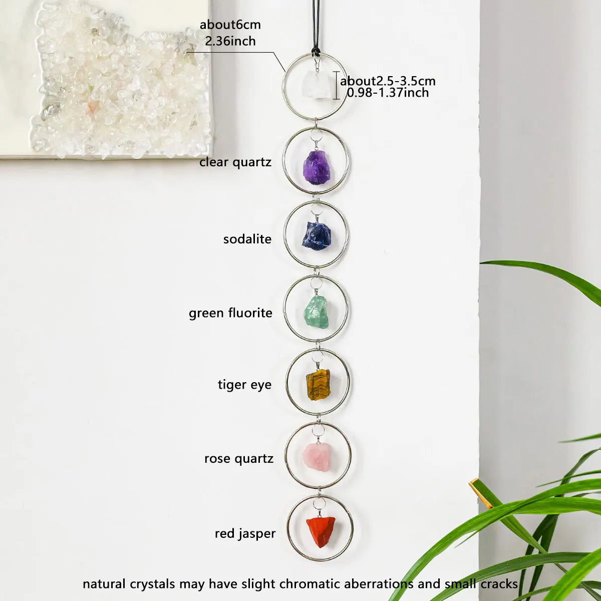 A string of seven crystal healing ornaments featuring quartz, sodalite, fluorite, tiger's eye, and jasper.