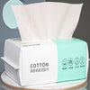A package of disposable cotton face towels for makeup and cleansing, featuring white and light green packaging.