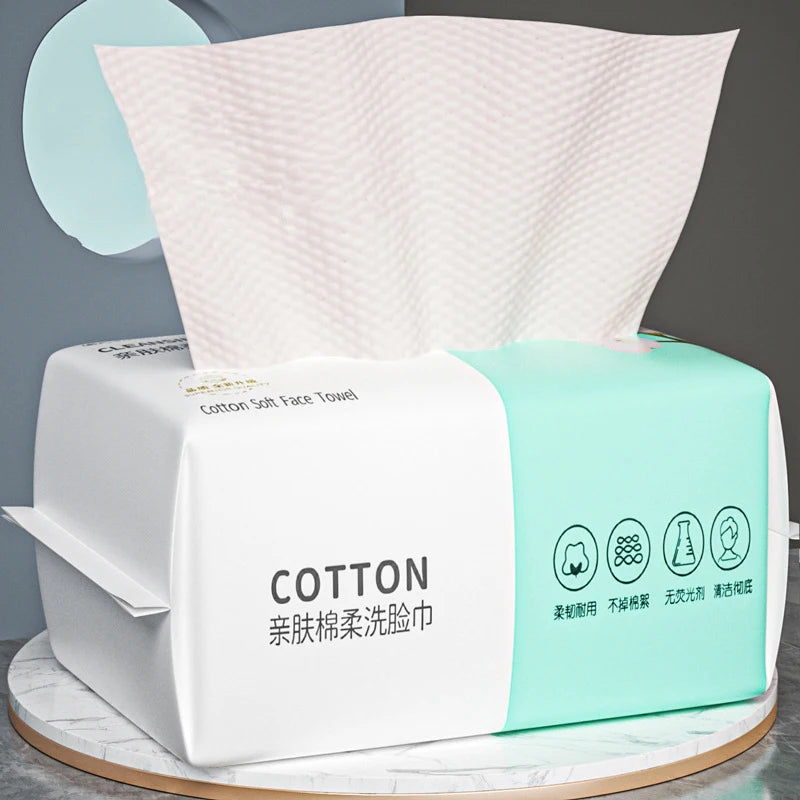 A package of disposable cotton face towels for makeup and cleansing, featuring white and light green packaging.