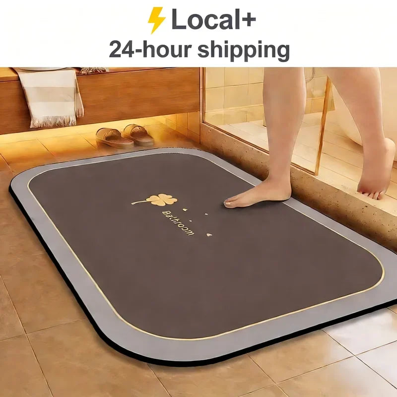A brown diatomite bath mat is placed on a tiled bathroom floor.