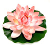 A pink artificial lotus flower blooming on a green leaf.