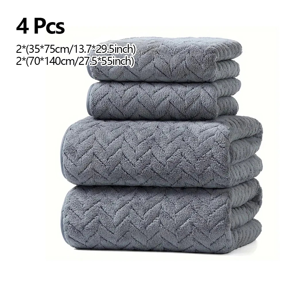 A stack of four gray microfiber absorbent towels, including two small and two large sizes.