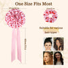 Pink satin silk hair bonnet with a large bow and ties, suitable for various hair types.