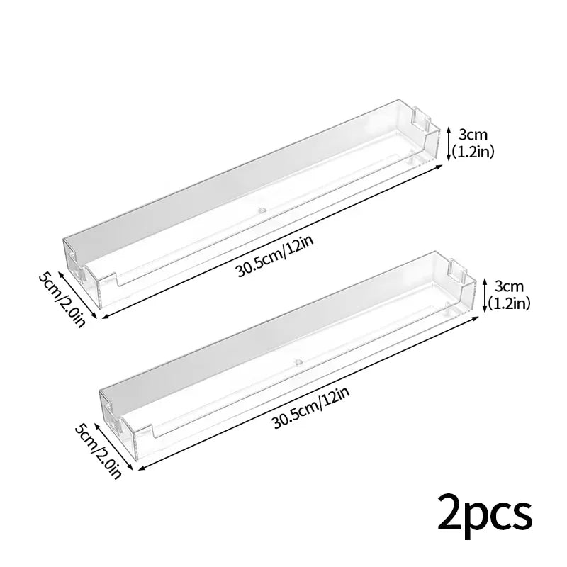 Two wall mounted acrylic display shelves, 30.5cm long with 5cm thick sides.