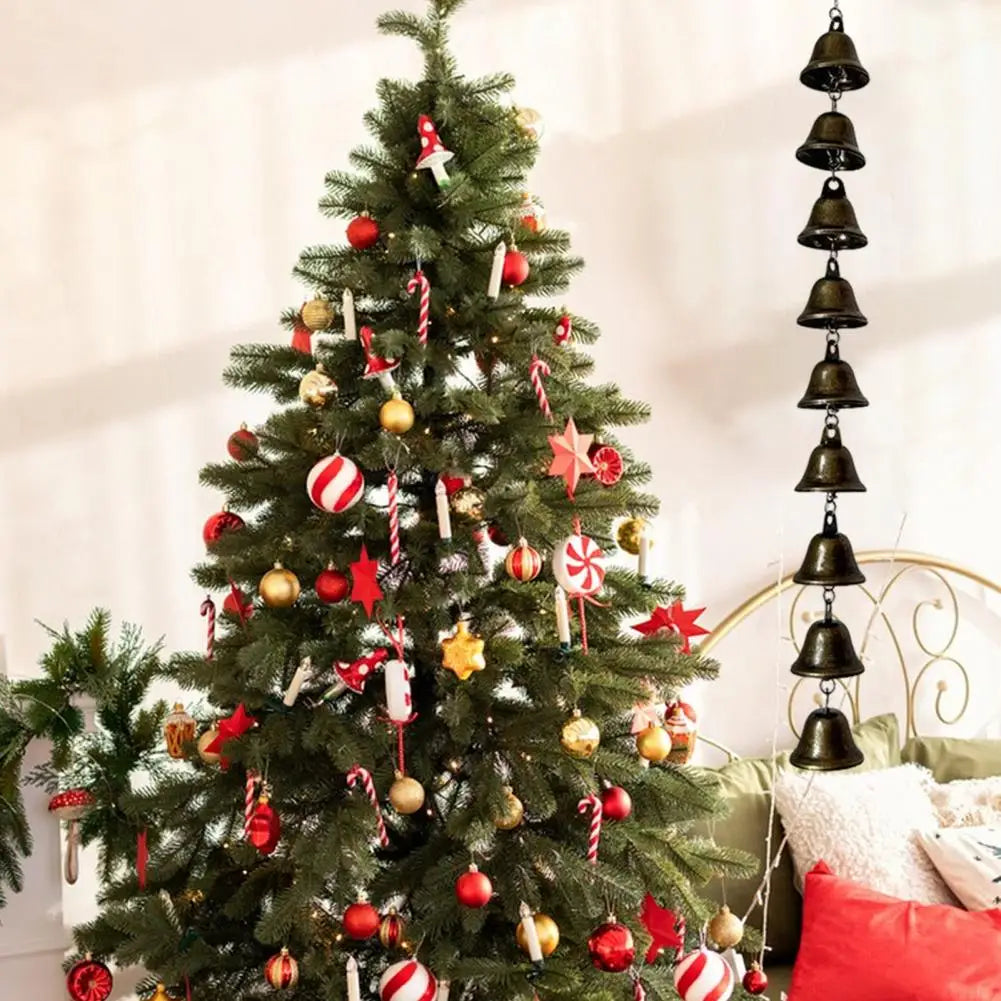 A decorated Christmas tree adorned with red and gold ornaments and silver ribbons.
