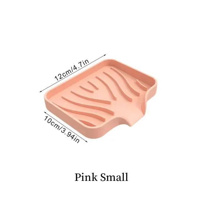 A pink silicone draining soap tray organizer with a wavy pattern, measuring 12cm long.