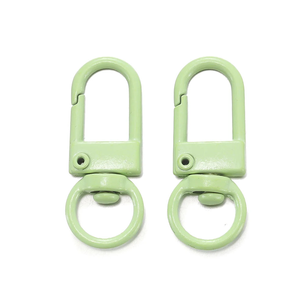 A pair of light green alloy snap lobster clasp hooks for jewelry making