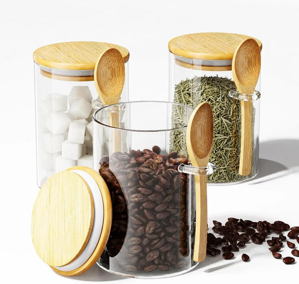A set of airtight glass spice jars with bamboo lids containing various dried spices like peppercorns and herbs.