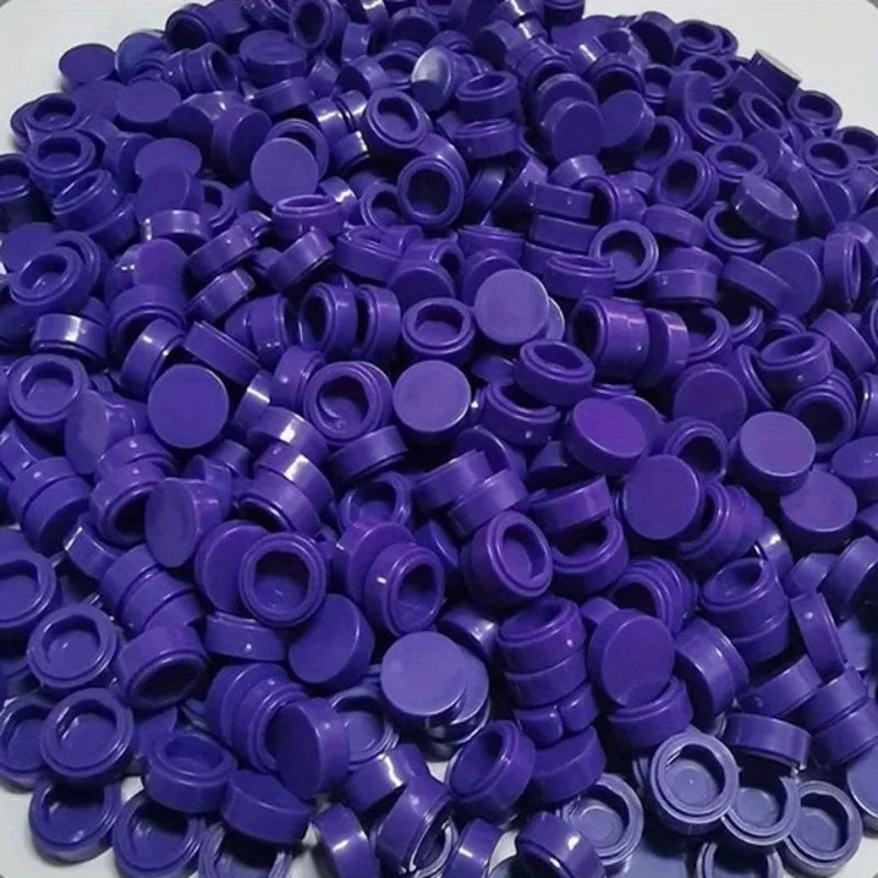 A pile of round purple building blocks for DIY projects.