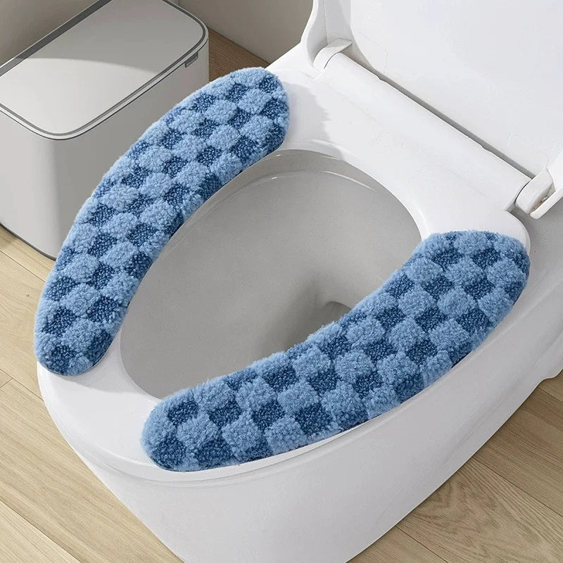 A blue patterned fabric cushion cover for a toilet seat is shown inside the toilet bowl.