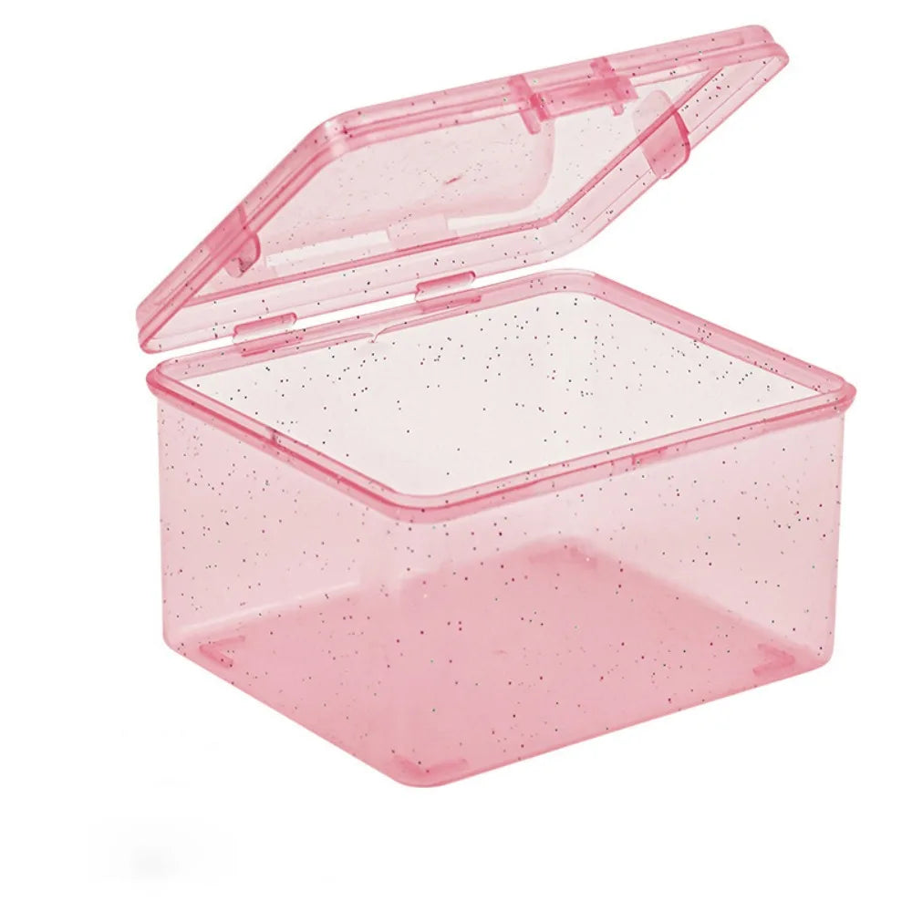 A clear pink plastic storage box with a hinged lid, designed for jewelry and small items.