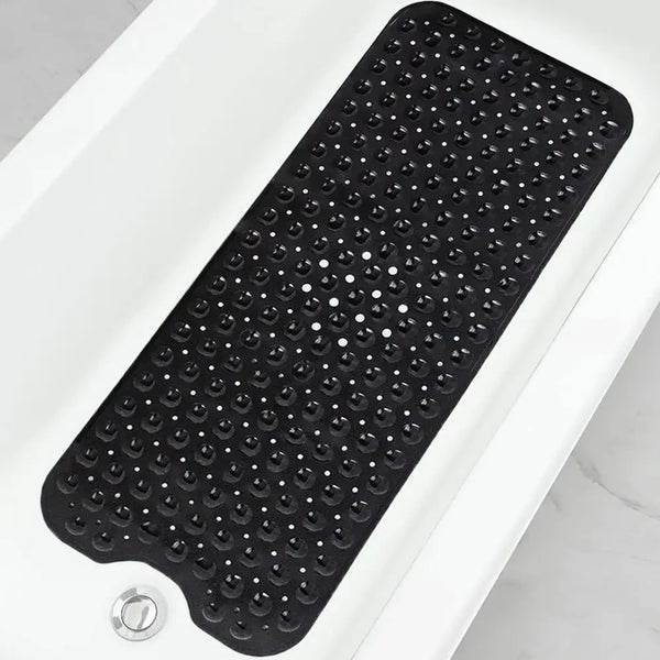 Black non-slip bathtub mat with suction cups placed on a white surface.