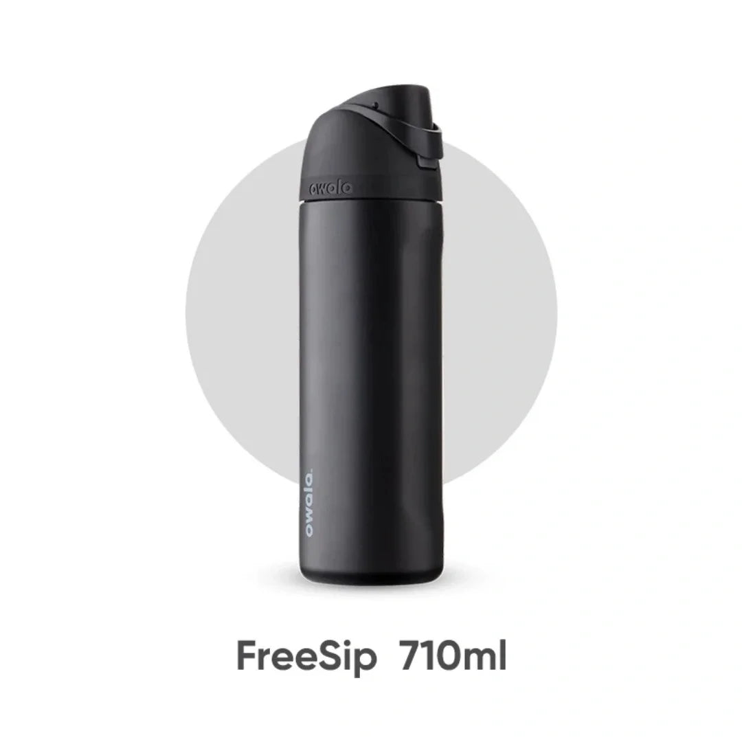 A black Owala FreeSip 710ml water bottle with a sports cap is shown against a white background.