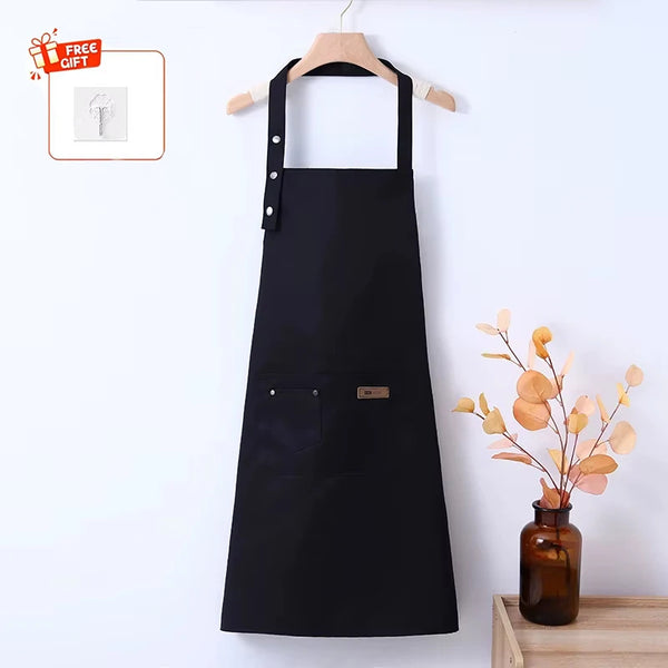 A black waterproof and oil-proof apron hanging on a wooden hanger against a white background.