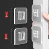Two double-sided adhesive wall hooks are shown being installed on a white surface.