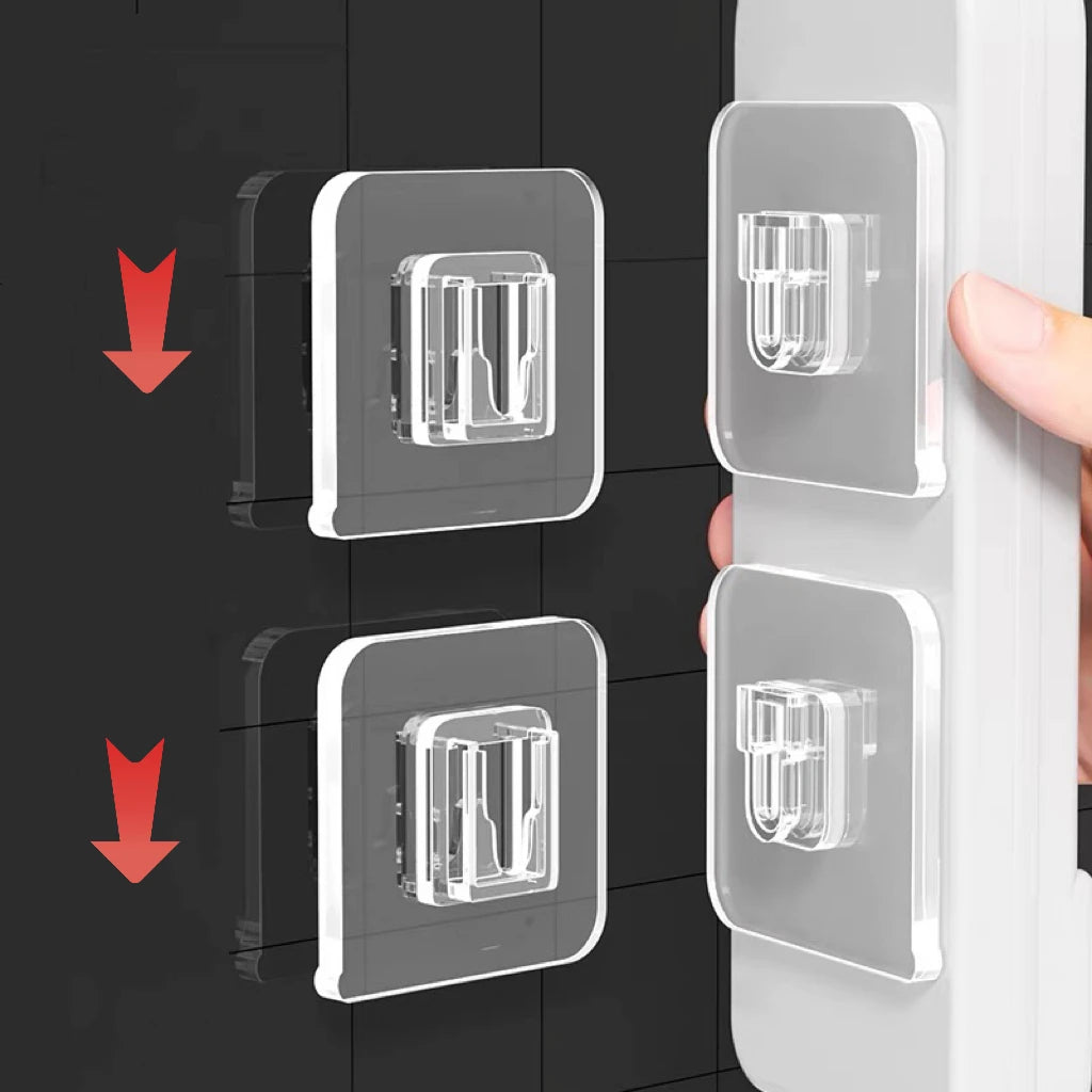 Two double-sided adhesive wall hooks are shown being installed on a white surface.