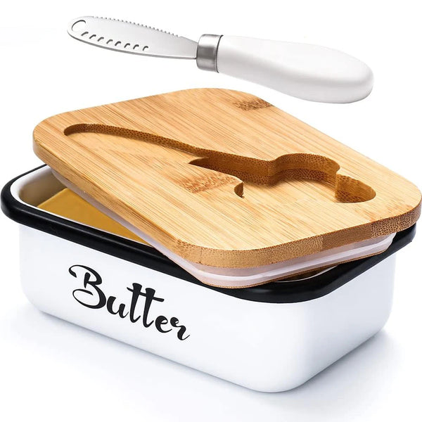 Elegant metal butter dish with a wooden lid and a silver knife resting above it.