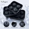 Black silicone spheres used as ice molds shown in a tray with water fill holes and anti-slip design
