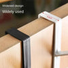 A close-up of a black door hook rack mounted on a wooden cabinet, showing its widened design and usage.
