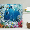 A colorful shower curtain featuring dolphins and sea turtles swimming underwater against a blue background.