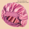 A pink satin wide brim shower cap shown from the side.