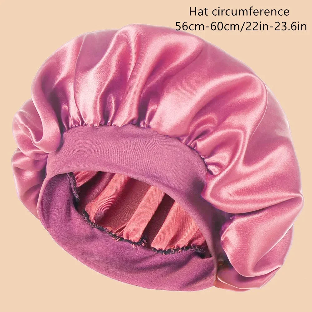 A pink satin wide brim shower cap shown from the side.