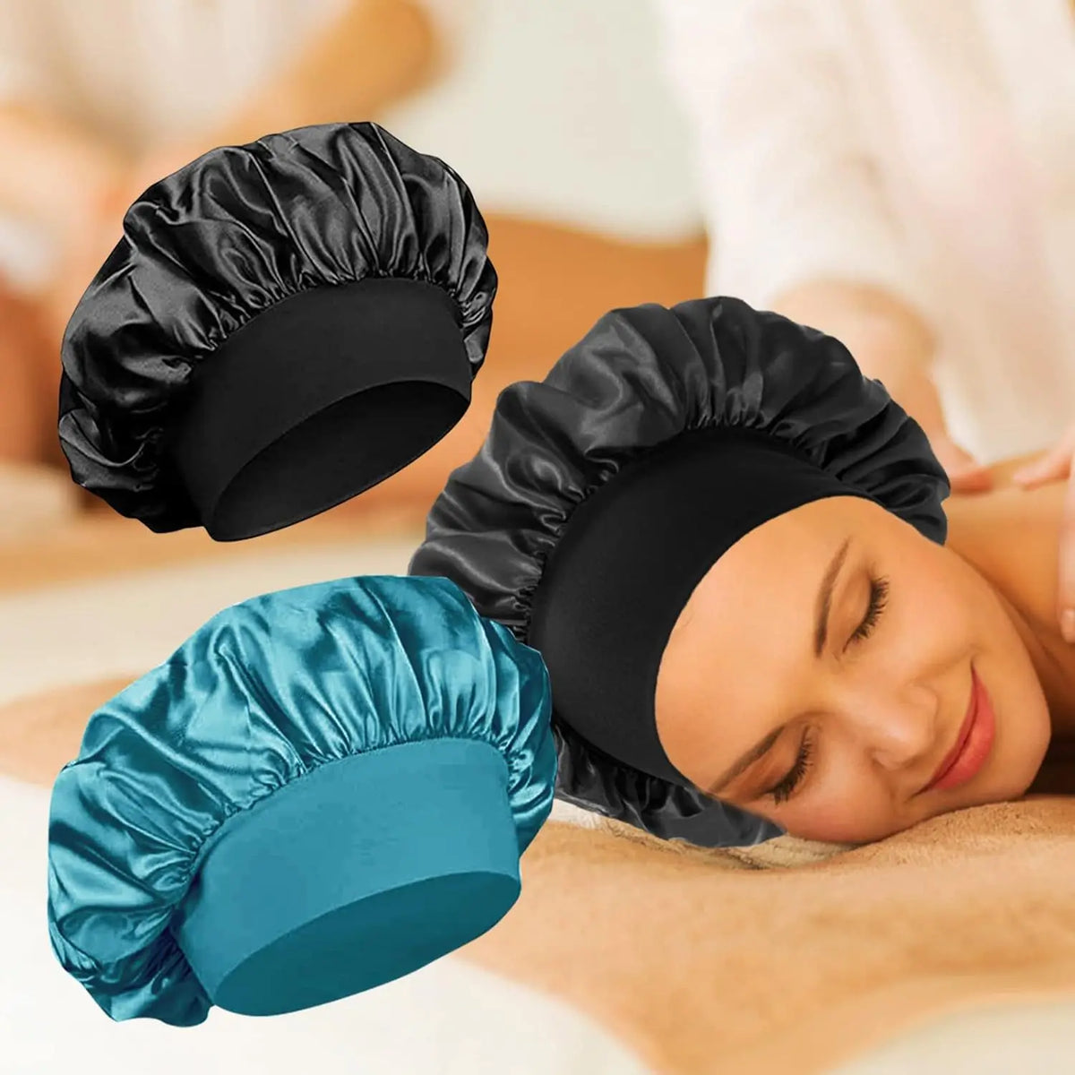 A woman is wearing a black satin wide-brim sleeping bonnet and a teal satin wide-brim sleeping bonnet.