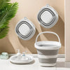 A white collapsible water bucket with a handle is shown alongside its various storage and stacking components.