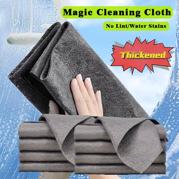 A stack of gray magic cleaning cloths is shown with water droplets, emphasizing they are thickened and stain-free.