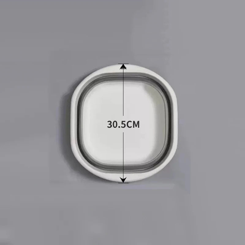 A white, oval-shaped plastic wash basin with a measurement line indicating 30.5cm.