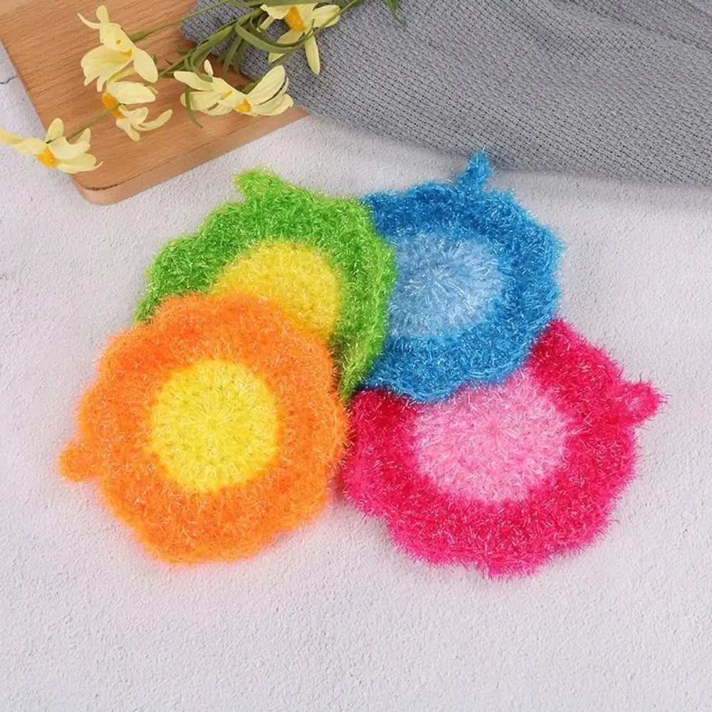 A collection of colorful, fluffy, non-stick acrylic dish towels shaped like flowers in various shades of green, yellow, blue,