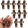 A collection of handcrafted wooden pocket crosses for stress relief, showing various designs and sizes.
