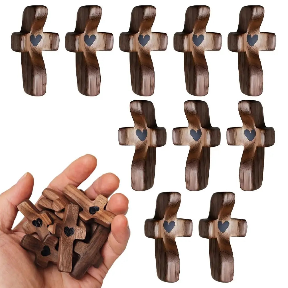 A collection of handcrafted wooden pocket crosses for stress relief, showing various designs and sizes.