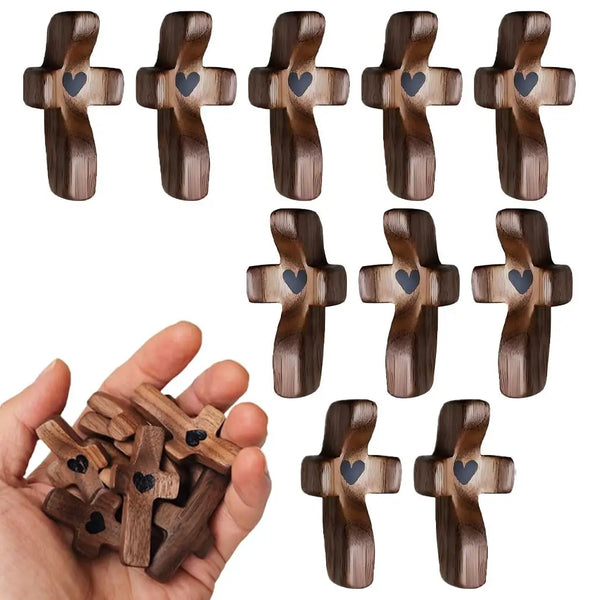 A collection of handcrafted wooden pocket crosses for stress relief, showing various designs and sizes.
