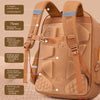 A tan school backpack featuring S-shaped shoulder straps, a chest buckle, and padded sections for comfort.