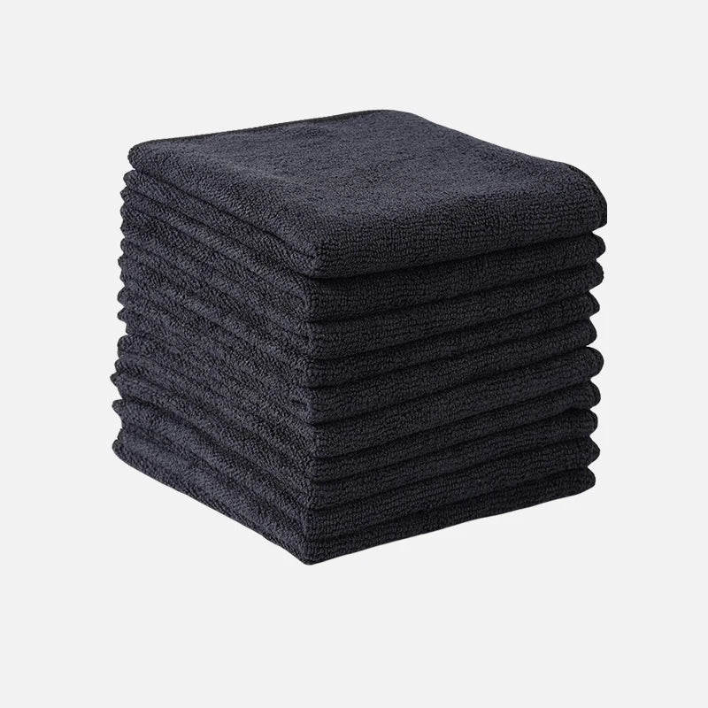 A stack of dark gray thickened microfiber cleaning cloths for glass and surfaces.