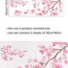 Pink cherry blossom branches with pink flowers on a light background