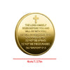 A round gold coin featuring a cross and the scripture Deuteronomy 31:8 engraved on it.