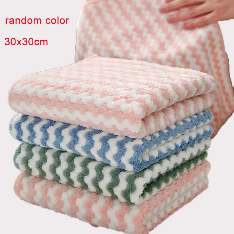 A stack of pink and blue microfiber kitchen dish cloths with a checkered pattern.