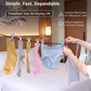 A portable clothesline with twelve colorful retractable clothespins is displayed over a bed.